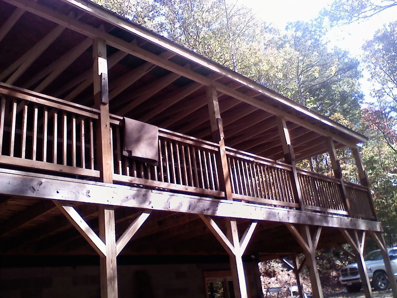 Timber framing under a new elevated porch and deck — Roof Leak Repair in Wellsburg by Roofing Brothers